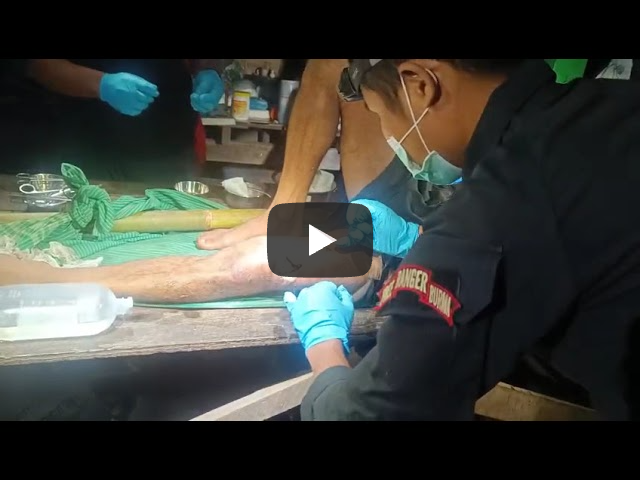 Ranger Medic treating a wounded Burma Army soldier.